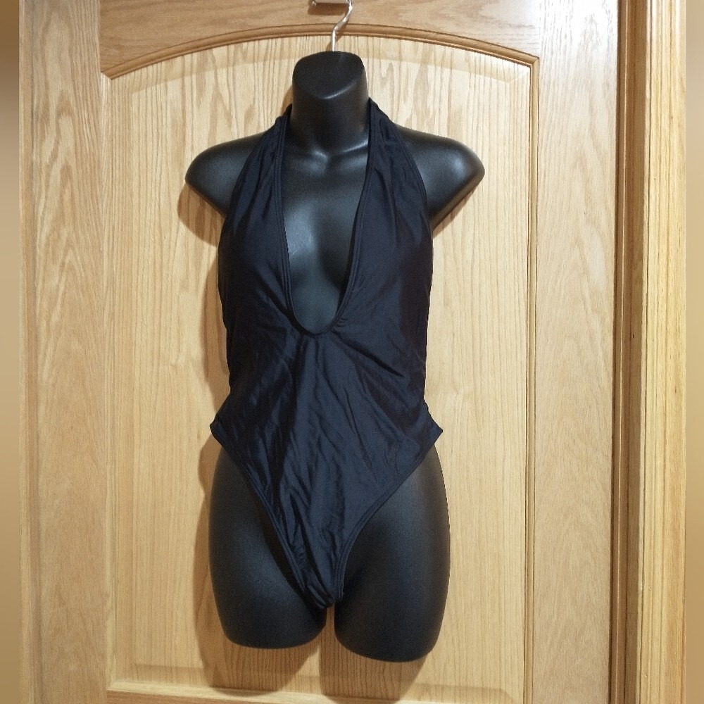 Black medium halter style 1 piece swimsuit sexy low cut NWOT
